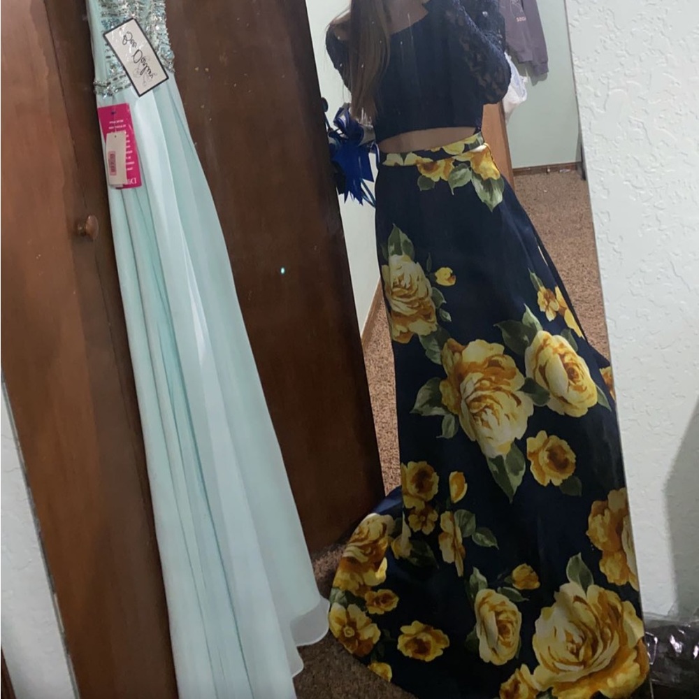 It is a blue and yellow two piece dress size 0